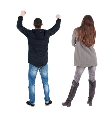 Back view of couple in winter jacket. beautiful friendly girl and guy together. Rear view people collection. backside view of person. Isolated over white background.の写真素材