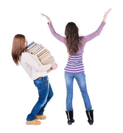 Back view of two woman in sweater. Rear view people collection. backside view of person. Isolated over white background. Girls are looking forwardの写真素材