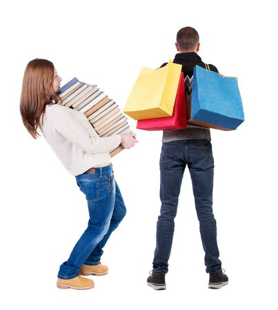 back view of couple with shopping bags. backside view of person. Rear view people collection. Isolated over white background.の写真素材