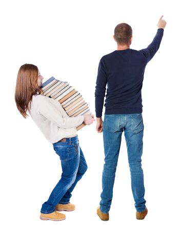 Back view of couple in sweater pointing. Rear view people collection. backside view of person. Isolated over white background.の写真素材