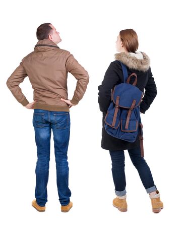Back view of couple in winter jacket. beautiful friendly girl and guy together. Rear view people collection. backside view of person. Isolated over white background.の写真素材