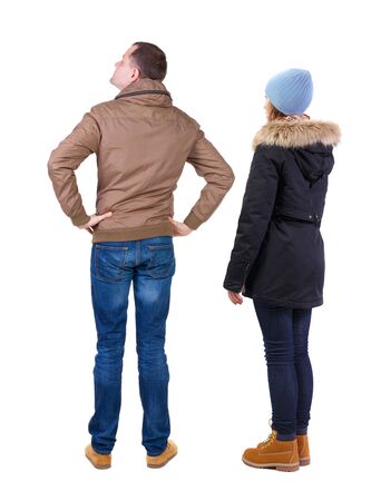 Back view of couple in winter jacket. beautiful friendly girl and guy together. Rear view people collection. backside view of person. Isolated over white background.の写真素材