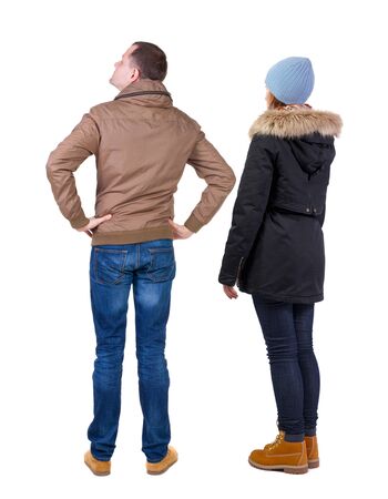 Back view of couple in winter jacket. beautiful friendly girl and guy together. Rear view people collection. backside view of person. Isolated over white background.の写真素材