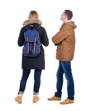Back view of couple in winter jacket. beautiful friendly girl and guy together. Rear view people collection. backside view of person. Isolated over white background.の写真素材