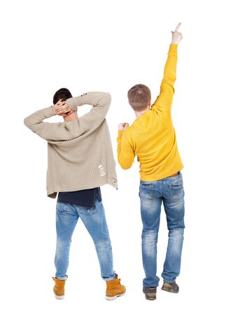 Back view of two man in sweater pointing. Rear view people collection. backside view of person. Isolated over white background.の写真素材