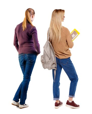 Back view of two woman in sweater. Rear view people collection. backside view of person. Isolated over white background. Girls are looking forwardの写真素材