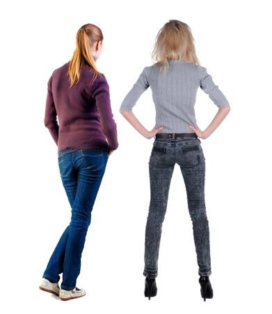 Back view of two woman in sweater. Rear view people collection. backside view of person. Isolated over white background. Girls are looking forwardの写真素材