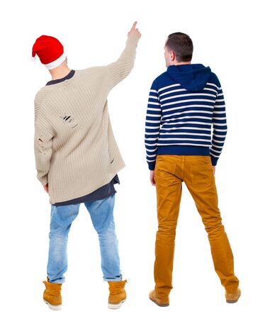 Back view of two man in sweater pointing. Rear view people collection. backside view of person. Isolated over white background.の写真素材