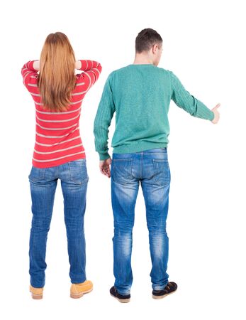 Back view of couple in sweater showing thumbs up. beautiful woman and man together. Rear view people collection. backside view of person. Isolated over white background.の写真素材
