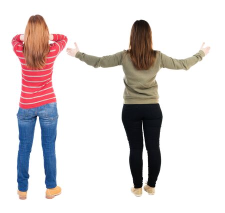 Back view of couple in sweater showing thumbs up. beautiful woman and man together. Rear view people collection. backside view of person. Isolated over white background.の写真素材