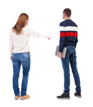 Back view couple with laptop in sweater. beautiful man and woman. Rear view people collection. backside view of person. Isolated over white background.の写真素材