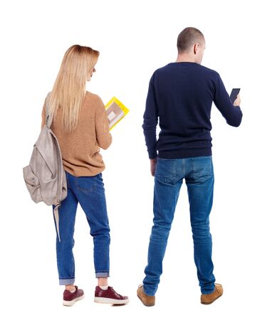 Back view of couple in sweater with mobile phone. Rear view people collection. backside view of person. Isolated over white background.の写真素材