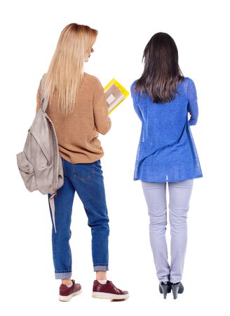 Back view of two woman in sweater. Rear view people collection. backside view of person. Isolated over white background.の写真素材