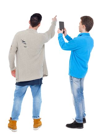 Back view of two man in sweater with mobile phone. Rear view people collection. backside view of person. Isolated over white background.の写真素材