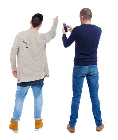 Back view of two man in sweater with mobile phone. Rear view people collection. backside view of person. Isolated over white background.の写真素材