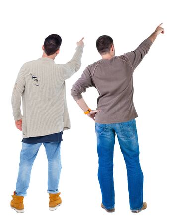Back view of two man in sweater pointing. Rear view people collection. backside view of person. Isolated over white background.の写真素材