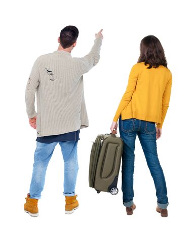 young couple in sweater traveling with suitcas. Back view. Rear view people collection. backside view of person. Isolated over white background.の写真素材