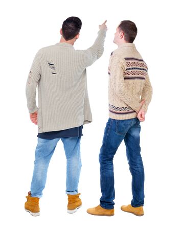Back view of two man in sweater pointing. Rear view people collection. backside view of person. Isolated over white background.の写真素材