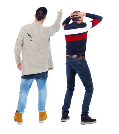 Back view of two man in sweater pointing. Rear view people collection. backside view of person. Isolated over white background.の写真素材