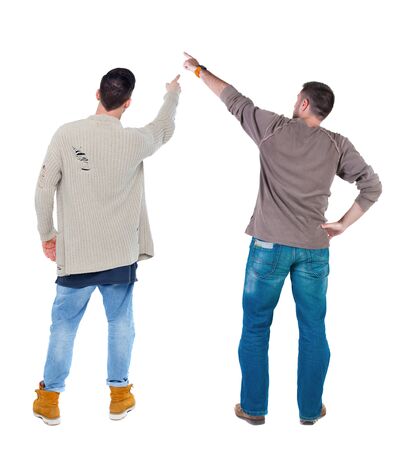 Back view of two man in sweater pointing. Rear view people collection. backside view of person. Isolated over white background.の写真素材