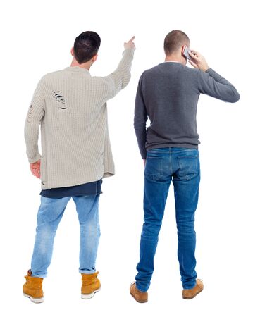 Back view of two man in sweater with mobile phone. Rear view people collection. backside view of person. Isolated over white background.の写真素材