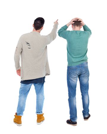Back view of two man in sweater pointing. Rear view people collection. backside view of person. Isolated over white background.の写真素材