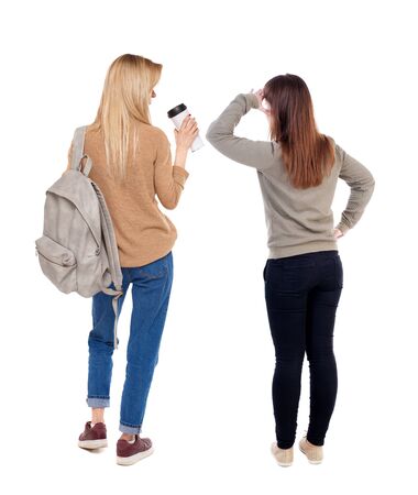 Back view of two woman in sweater. Rear view people collection. backside view of person. Isolated over white background.の写真素材