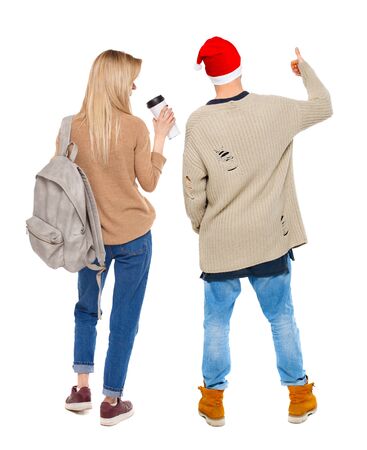 Back view of couple in sweater showing thumbs up. beautiful woman and man together. Rear view people collection. backside view of person. Isolated over white background.の写真素材