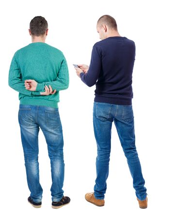 Back view of two man in sweater with mobile phone. Rear view people collection. backside view of person. Isolated over white background.の写真素材