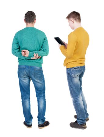 Back view of two man in sweater with mobile phone. Rear view people collection. backside view of person. Isolated over white background.の写真素材