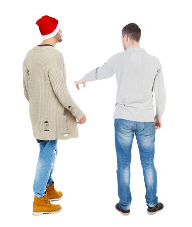 Back view of two man in sweater pointing. Rear view people collection. backside view of person. Isolated over white background.の写真素材