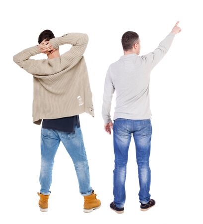 Back view of two man in sweater pointing. Rear view people collection. backside view of person. Isolated over white background.の写真素材