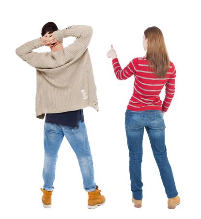 Back view of couple in sweater showing thumbs up. beautiful woman and man together. Rear view people collection. backside view of person. Isolated over white background.の写真素材