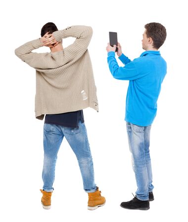 Back view of two man in sweater with mobile phone. Rear view people collection. backside view of person. Isolated over white background.の写真素材
