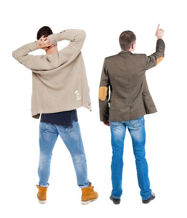 Back view of two man in sweater pointing. Rear view people collection. backside view of person. Isolated over white background.の写真素材