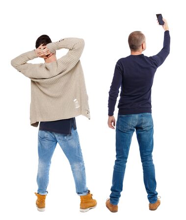 Back view of two man in sweater with mobile phone. Rear view people collection. backside view of person. Isolated over white background.の写真素材