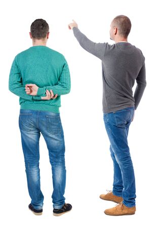 Back view of two man in sweater pointing. Rear view people collection. backside view of person. Isolated over white background.の写真素材