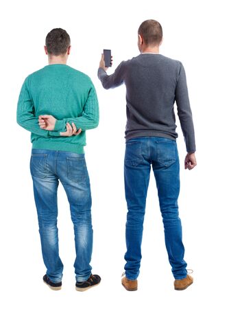 Back view of two man in sweater with mobile phone. Rear view people collection. backside view of person. Isolated over white background.の写真素材