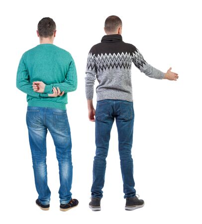 Back view of two man in sweater pointing. Rear view people collection. backside view of person. Isolated over white background.の写真素材