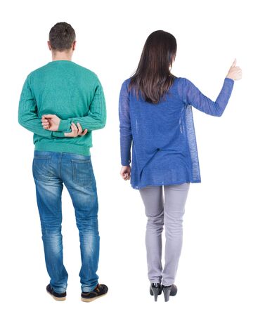 Back view of couple in sweater showing thumbs up. beautiful woman and man together. Rear view people collection. backside view of person. Isolated over white background.の写真素材
