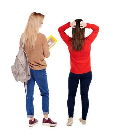 Back view of two woman in sweater. Rear view people collection. backside view of person. Isolated over white background.の写真素材