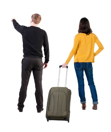 young couple in sweater traveling with suitcas. Back view. Rear view people collection. backside view of person. Isolated over white background.の写真素材