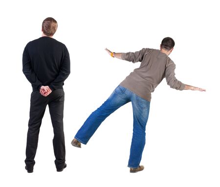 Back view of two man in sweater pointing. Rear view people collection. backside view of person. Isolated over white background.の写真素材