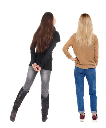Back view of two woman in sweater. Rear view people collection. backside view of person. Isolated over white background.の写真素材