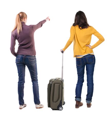 young couple in sweater traveling with suitcas. Back view. Rear view people collection. backside view of person. Isolated over white background.の写真素材