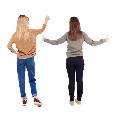 Back view of couple in sweater showing thumbs up. beautiful woman and man together. Rear view people collection. backside view of person. Isolated over white background.の写真素材