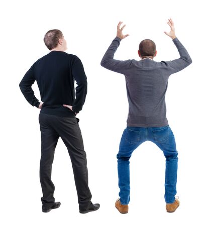 Back view of two man in sweater pointing. Rear view people collection. backside view of person. Isolated over white background.の写真素材