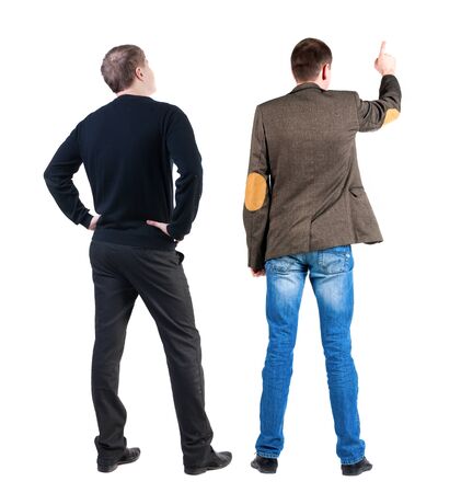 Back view of two man in sweater pointing. Rear view people collection. backside view of person. Isolated over white background.の写真素材