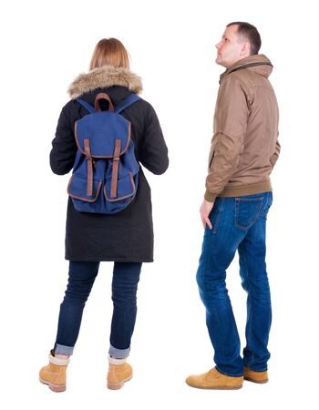Back view of couple in winter jacket. beautiful friendly girl and guy together. Rear view people collection. backside view of person. Isolated over white background.の写真素材