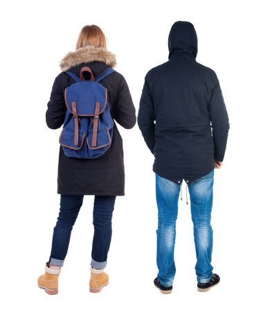 Back view of couple in winter jacket. beautiful friendly girl and guy together. Rear view people collection. backside view of person. Isolated over white background.の写真素材